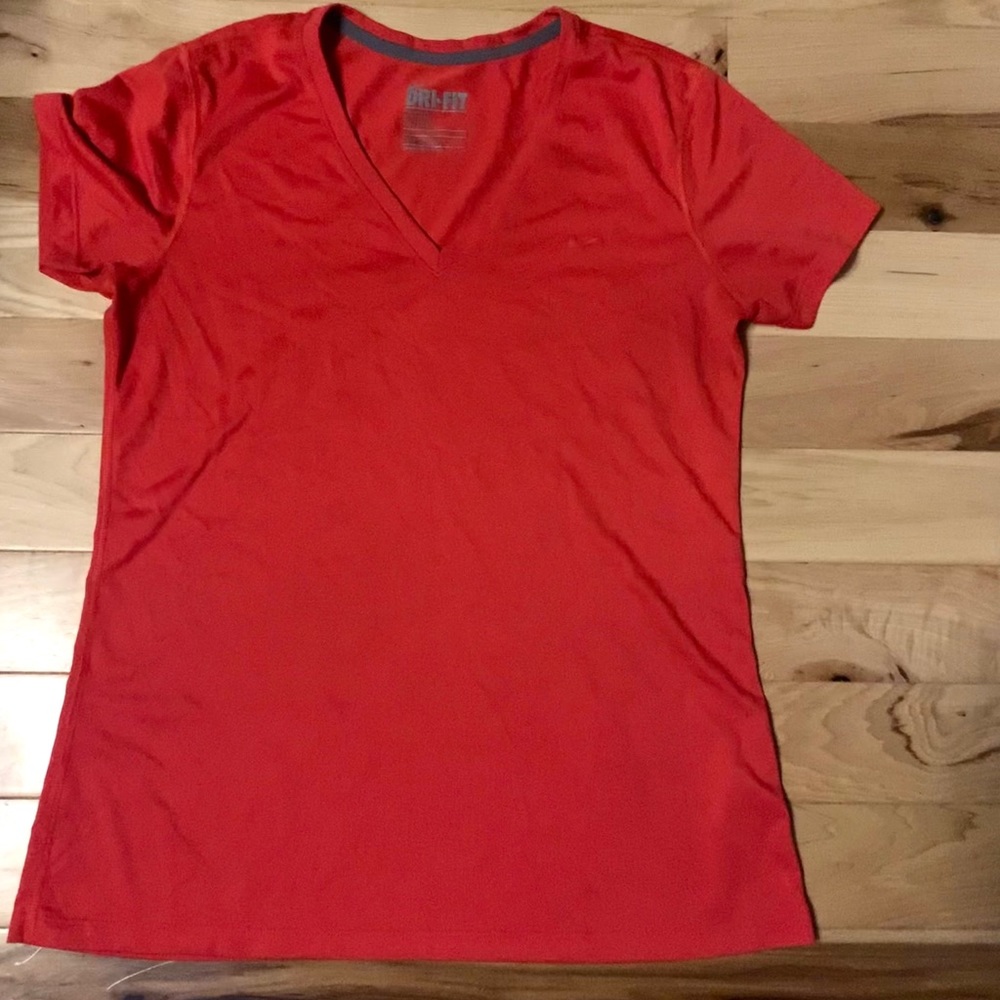 Coral Pink Nike Dri-Fit V neck shirt.